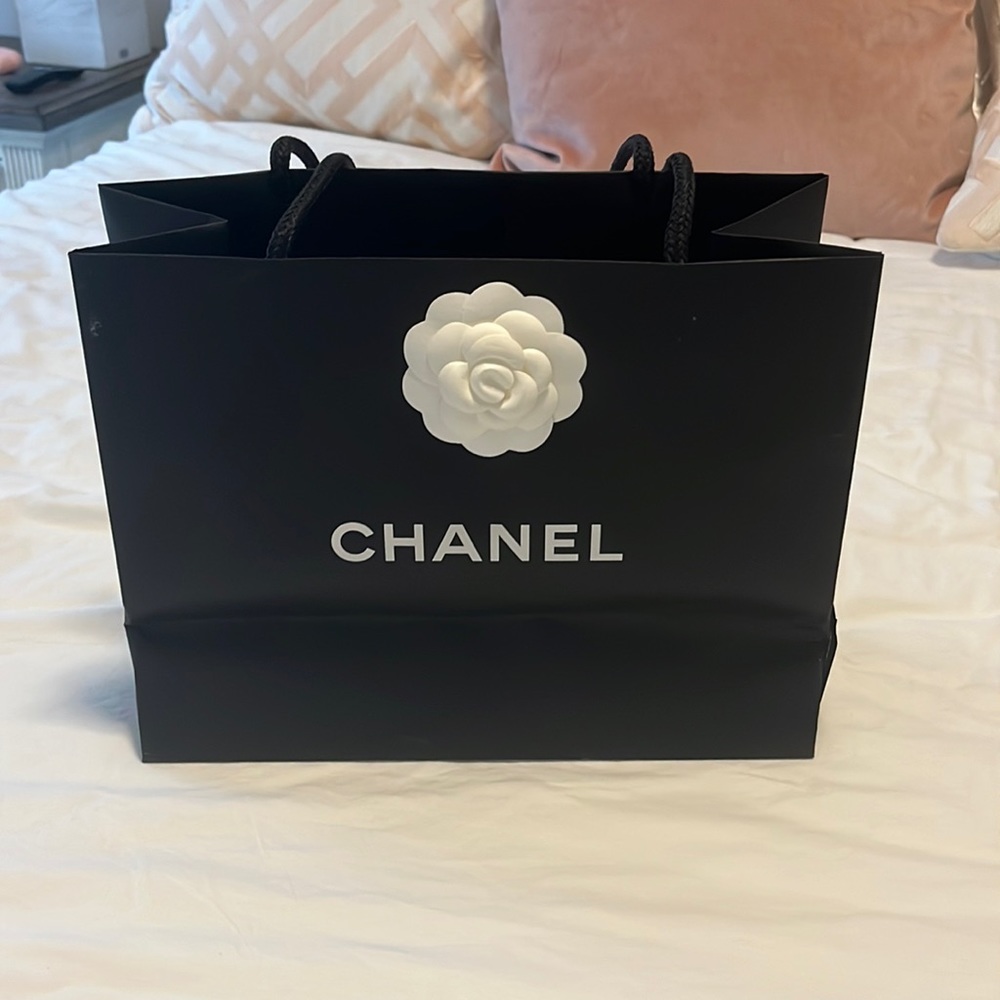 Small Chanel shopping bag with ribbon and Camellia